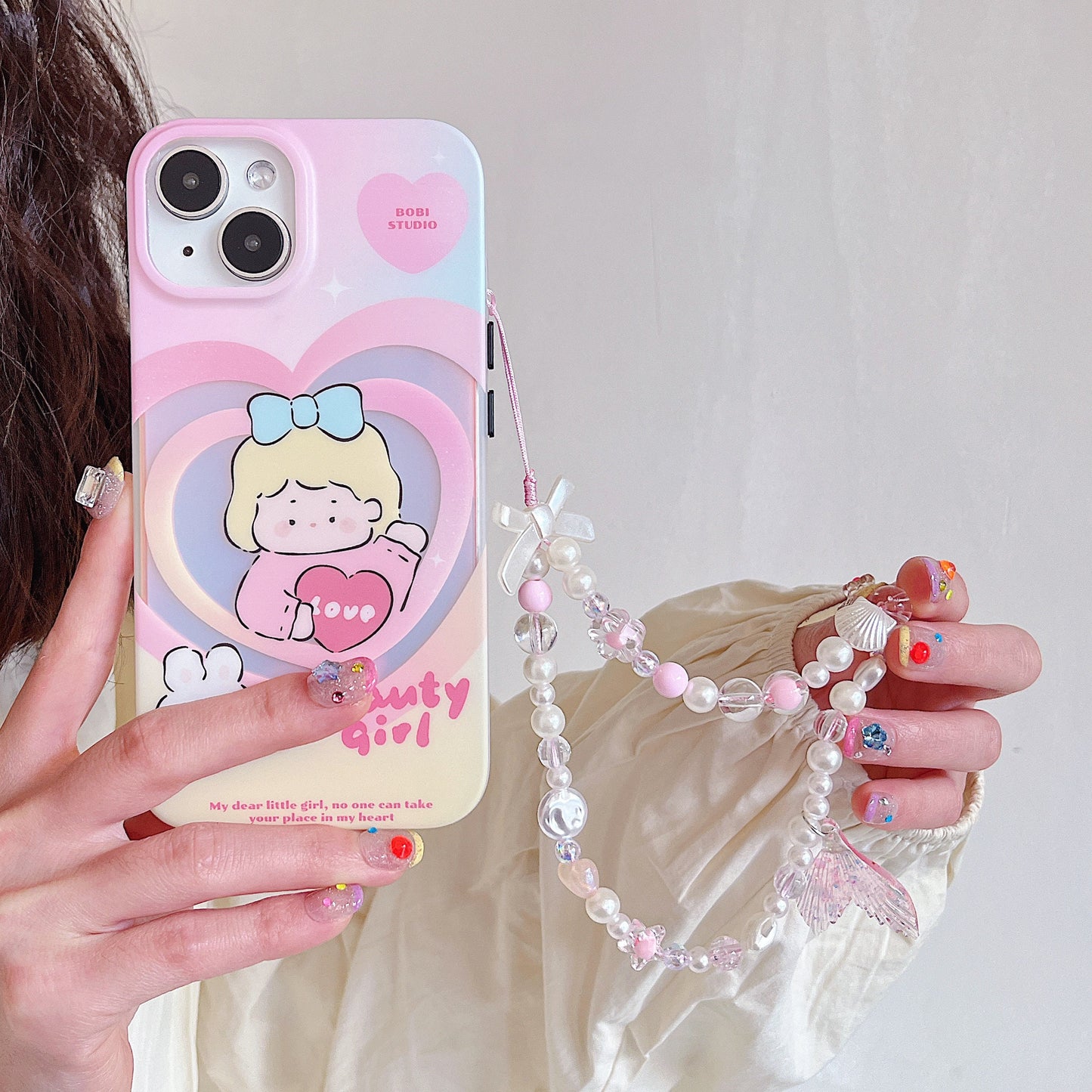 Discover the ocean-inspired Mermaid Beaded Pearl Phone Charm in 4 vibrant colors – a secure, stylish, and versatile Y2K accessory perfect for tech lovers and beach enthusiasts alike!