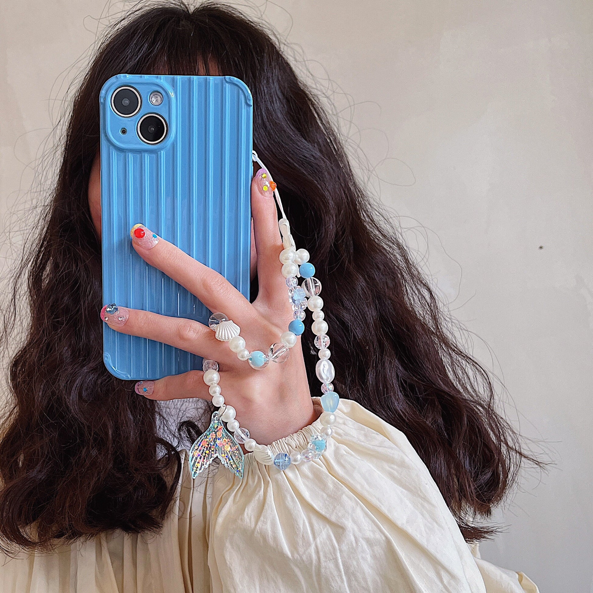 Discover the ocean-inspired Mermaid Beaded Pearl Phone Charm in 4 vibrant colors – a secure, stylish, and versatile Y2K accessory perfect for tech lovers and beach enthusiasts alike!